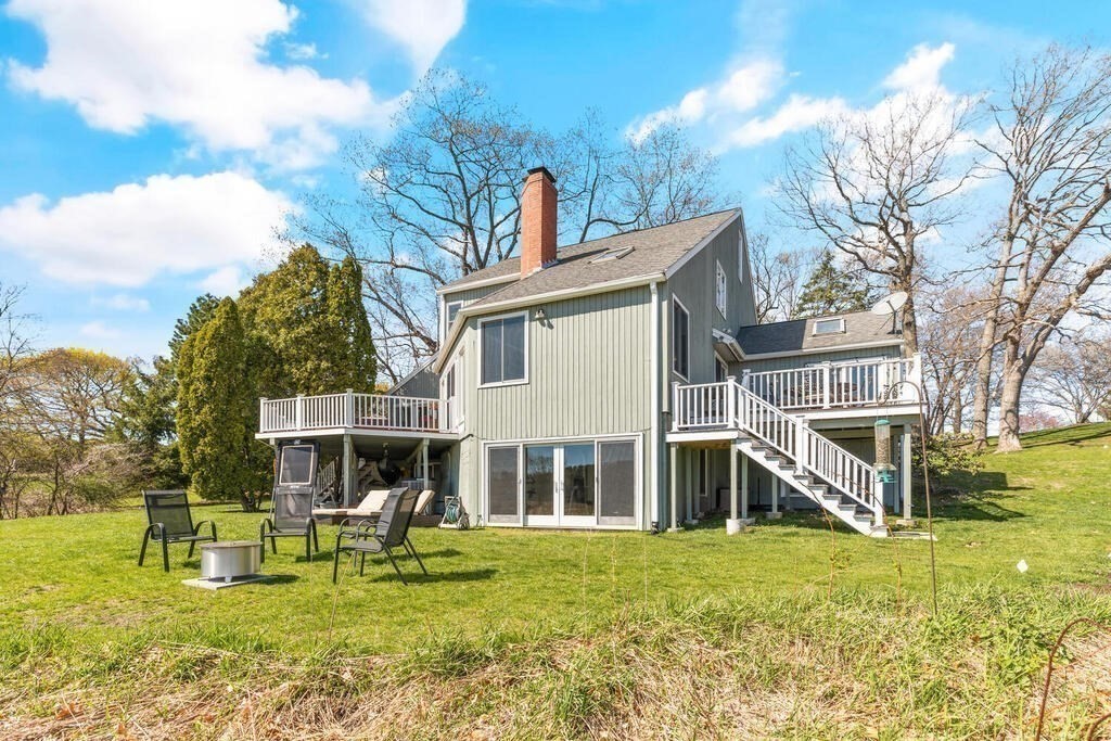 164 Marrett Road Lexington, MA 02421 - Photo 30 of 41 a front view of house with yard and seating area