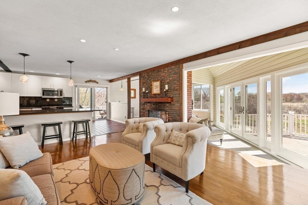 164 Marrett Road Lexington, MA 02421 - Photo 5 of 41 a living room with fireplace furniture and a large window