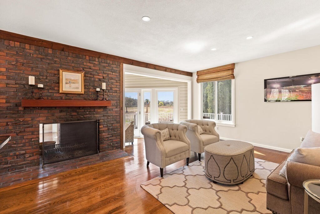 164 Marrett Road Lexington, MA 02421 - Photo 6 of 41 a living room with furniture and a fireplace