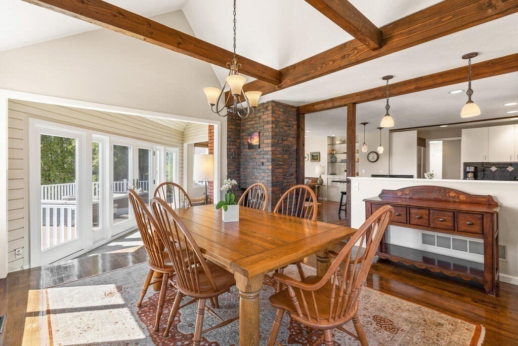 164 Marrett Road Lexington, MA 02421 - Photo 8 of 41 a dining room with furniture a chandelier and wooden floor