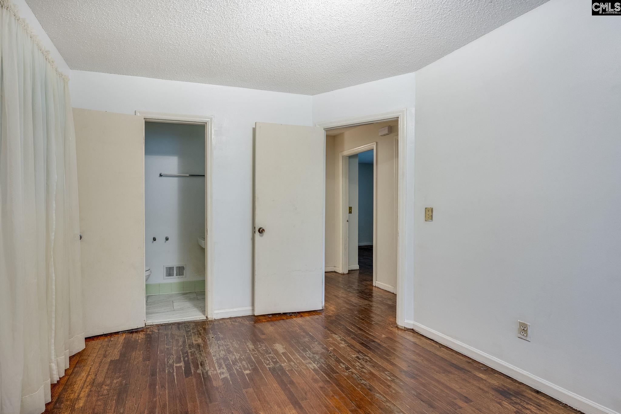 5666 Middleton Court Columbia, SC 29203 - Photo 30 of 42 a view of an empty room with wooden floor and closet
