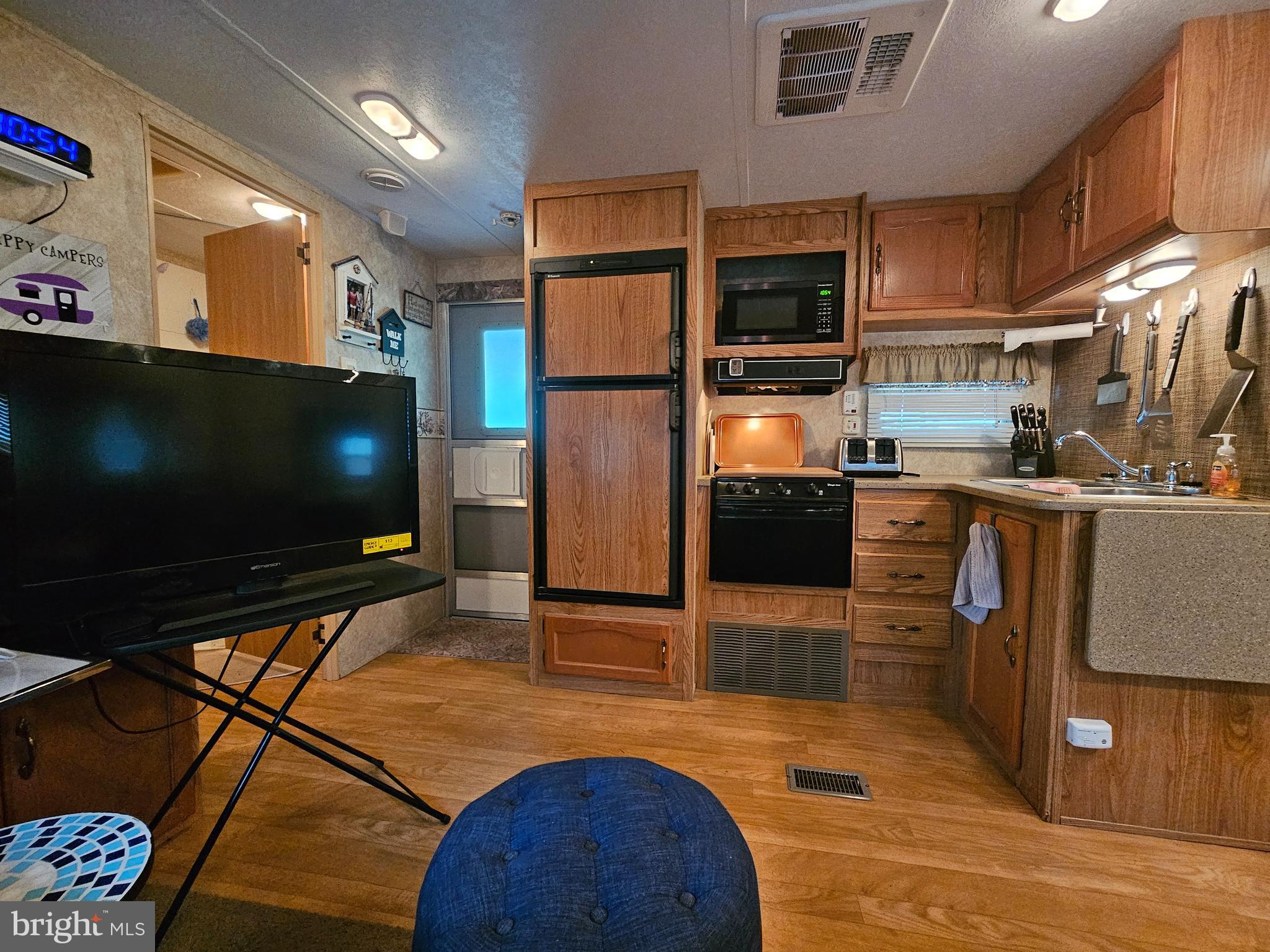 6 Boo Boo Boulevard Falling Waters, WV 25419 - Photo 11 of 43 a living room with stainless steel appliances furniture and a flat screen tv