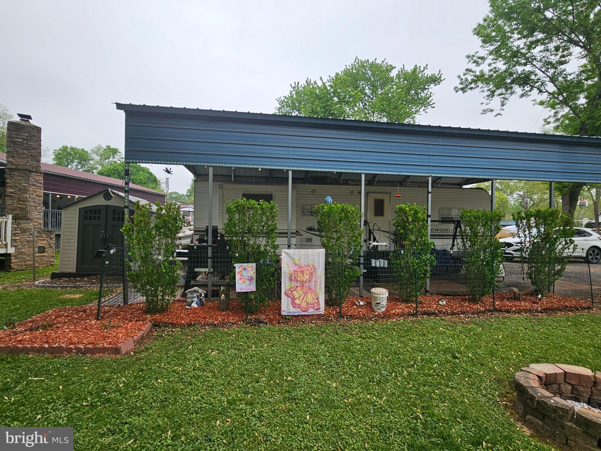 6 Boo Boo Boulevard Falling Waters, WV 25419 - Photo 2 of 43 a view of a backyard with plants and a garden
