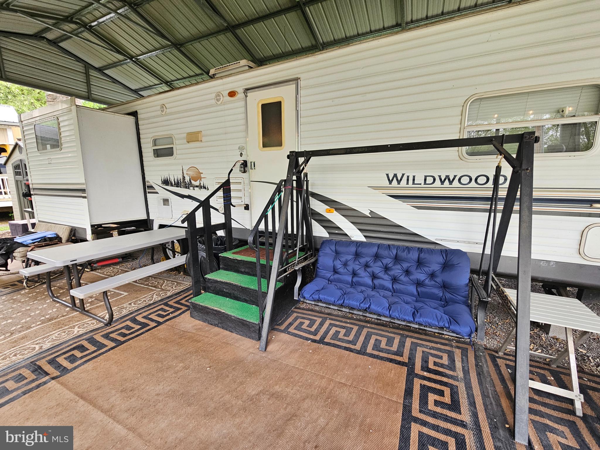 6 Boo Boo Boulevard Falling Waters, WV 25419 - Photo 6 of 43 a roof deck with a table and chairs