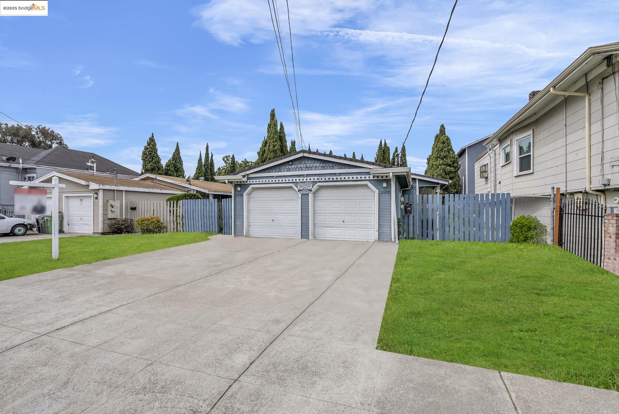 2933 Filbert Street Oakland, CA 94608 - Photo 1 of 1 a front view of a house with a garden and yard