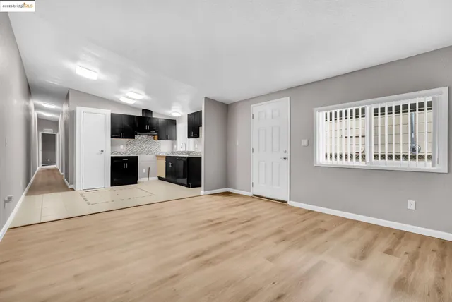 a view of a kitchen with a sink and a microwave