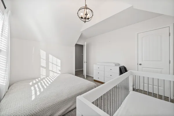 view of a bathroom with a toilet and a shower