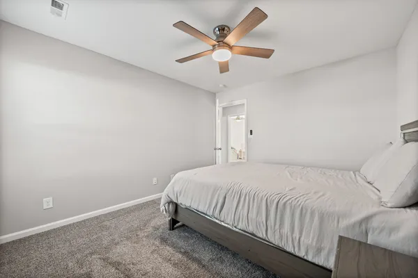 a bedroom with a bed furniture and a window