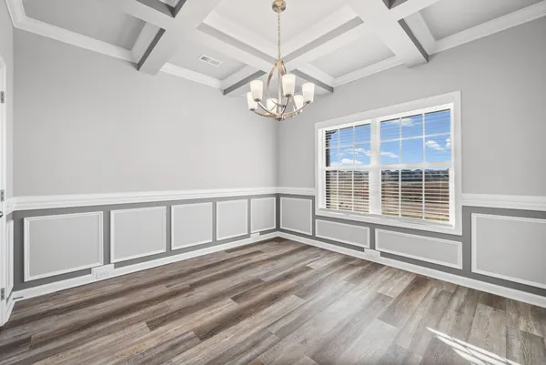 a room with furniture and a wooden floor