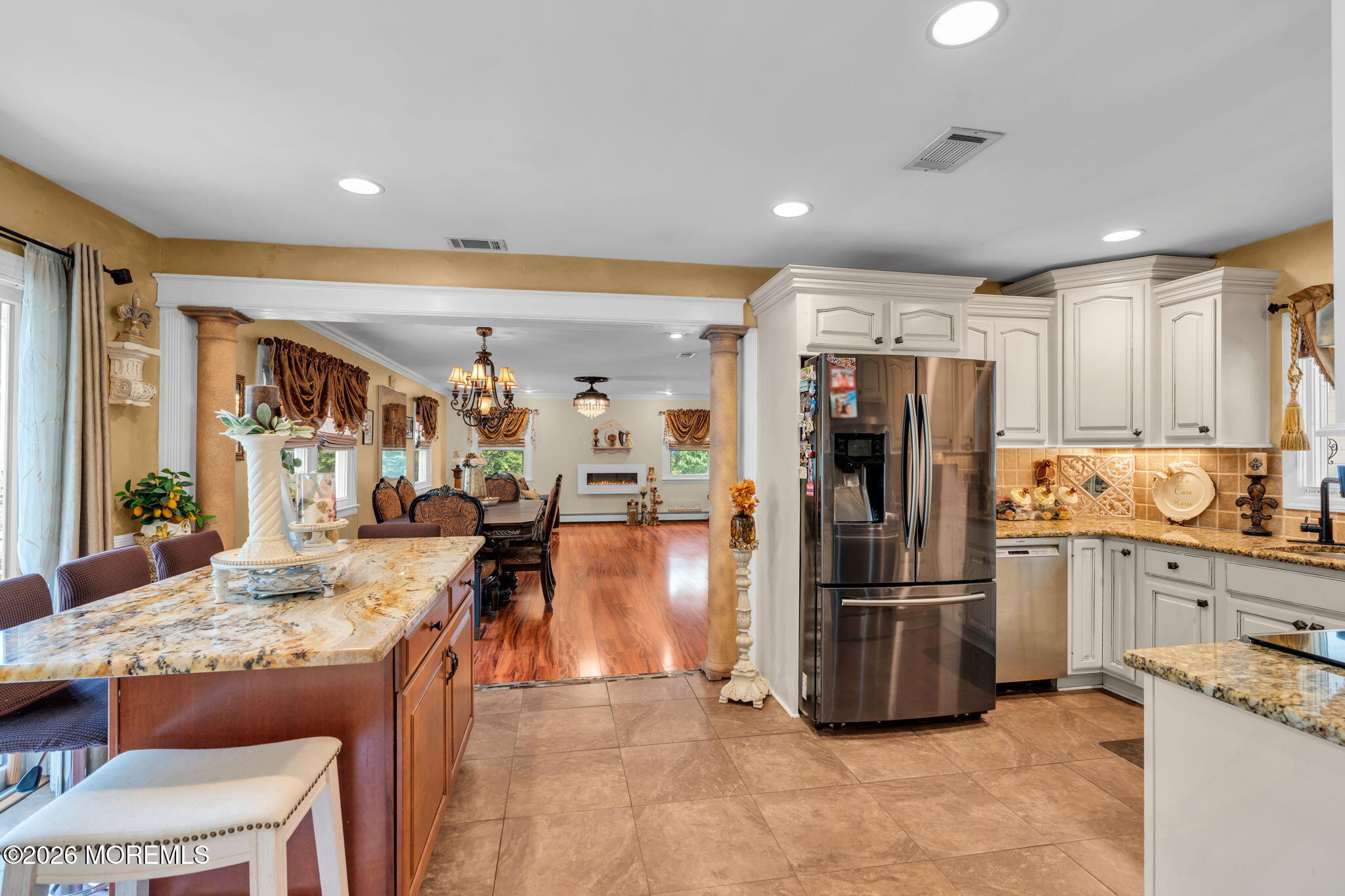 8 Owens Road Marlboro, NJ 07746 - Photo 12 of 39 a kitchen with stainless steel appliances kitchen island granite countertop a refrigerator and a stove top oven