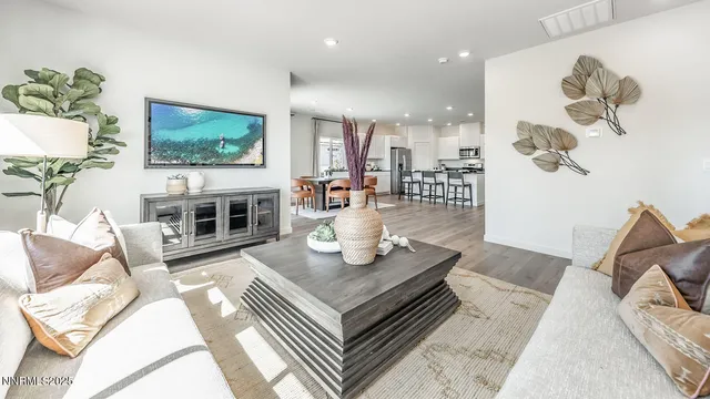 a living room with fireplace furniture and a flat screen tv