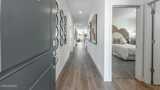 a view of hallway with livingroom and furniture