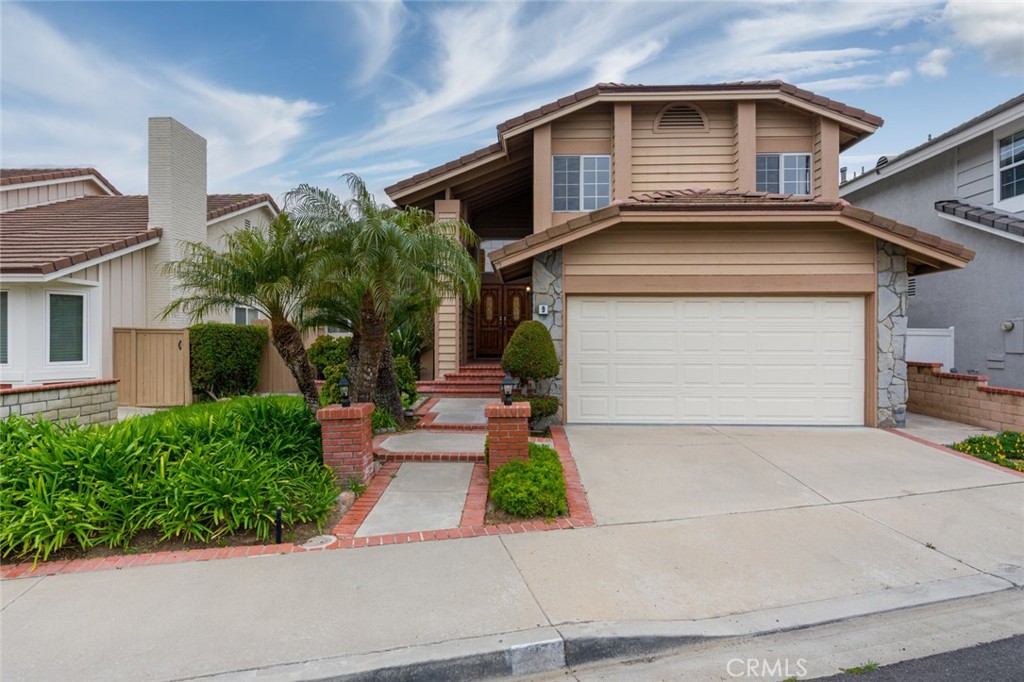 a front view of a house with garage