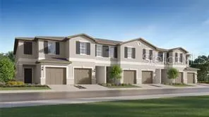 a front view of residential houses with yard