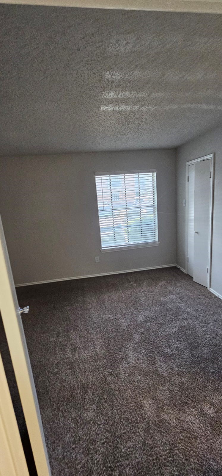 3737 Timberglen Road, Unit 2110 Dallas, TX 75287 - Photo 6 of 19 a view of a livingroom with a window