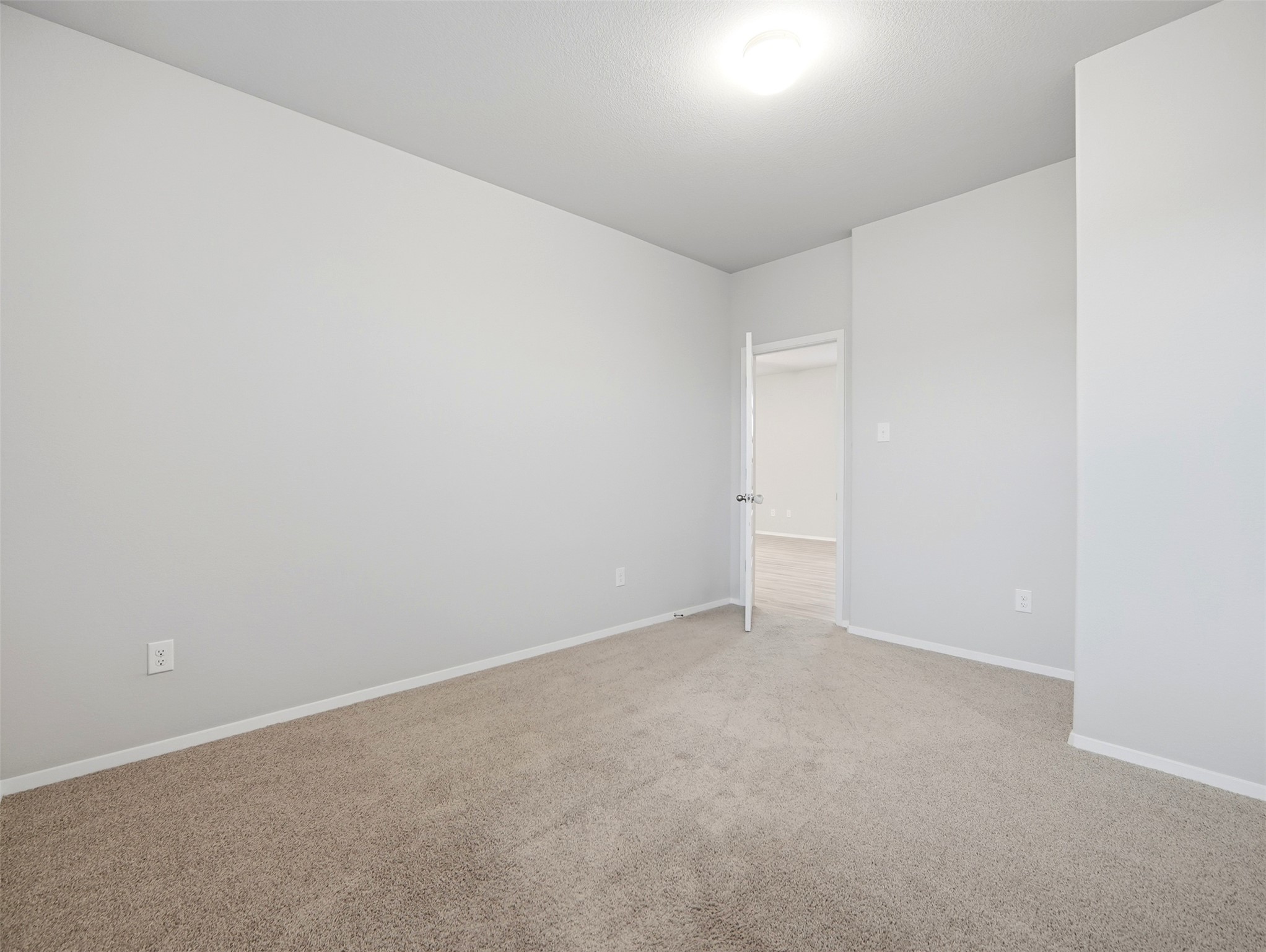 60 Bent Trl Lane Georgetown, TX 78628 - Photo 14 of 40 A spacious room offers comfortable carpeting, ready for personalization.