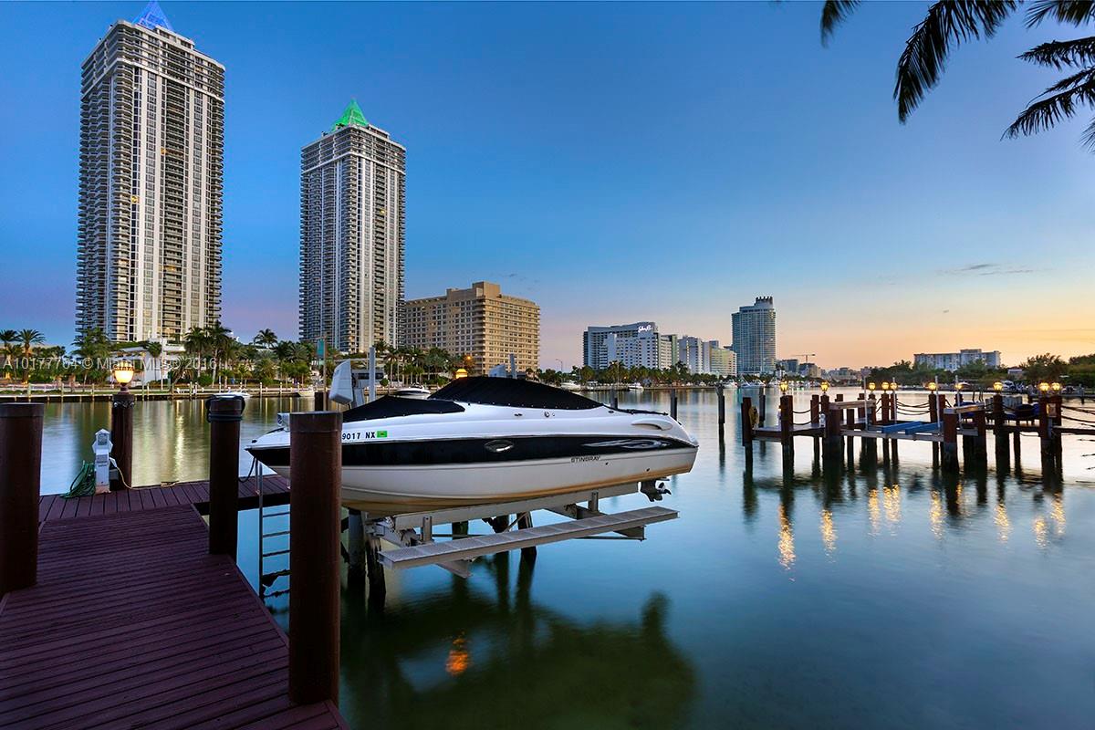 4855 Pine Tree Drive Miami Beach, FL 33140 - Photo 11 of 26 a dining room with furniture and wooden floor
