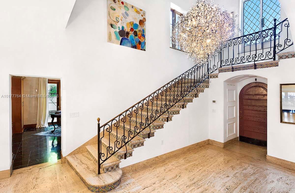 4855 Pine Tree Drive Miami Beach, FL 33140 - Photo 12 of 26 a view of entryway and hall with wooden floor