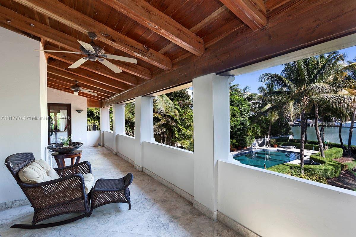 4855 Pine Tree Drive Miami Beach, FL 33140 - Photo 3 of 26 a outdoor living space with furniture and garden view