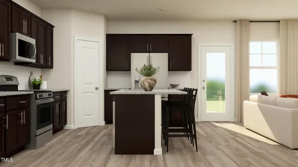 a dining room with furniture and wooden floor