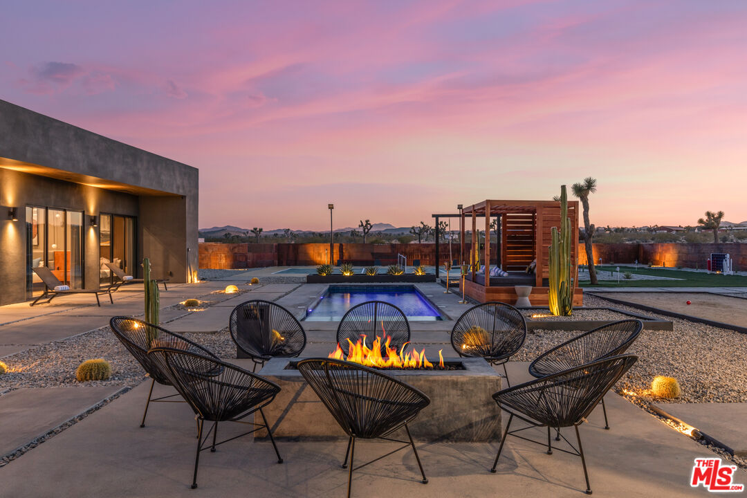 3000 Rockwood Road Joshua Tree, CA 92252 - Photo 12 of 71 a view of a swimming pool and lounge chairs