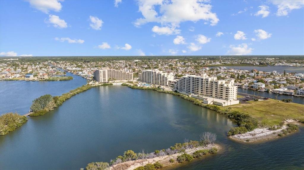 6009 Sea Ranch Drive, Unit 303 Hudson, FL 34667 - Photo 1 of 48 a view of a lake with a city view