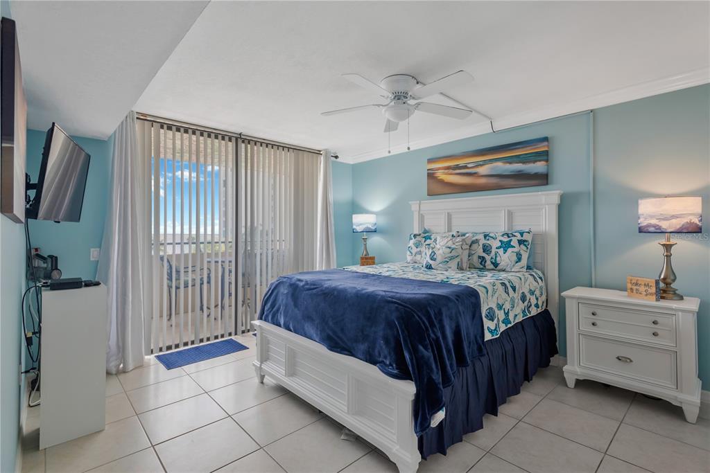 6009 Sea Ranch Drive, Unit 303 Hudson, FL 34667 - Photo 12 of 48 a bedroom with a bed and a window