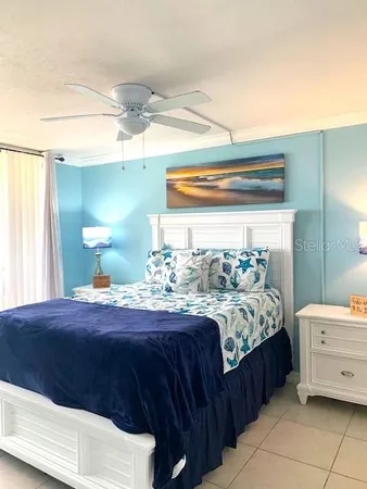 a bedroom with a bed and a dresser
