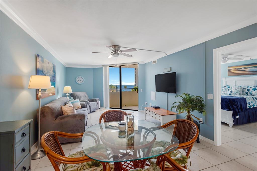 6009 Sea Ranch Drive, Unit 303 Hudson, FL 34667 - Photo 15 of 48 a dining room with furniture and wooden floor