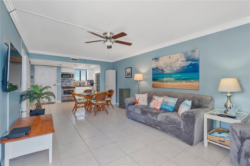 6009 Sea Ranch Drive, Unit 303 Hudson, FL 34667 - Photo 19 of 48 a living room with furniture and a potted plant