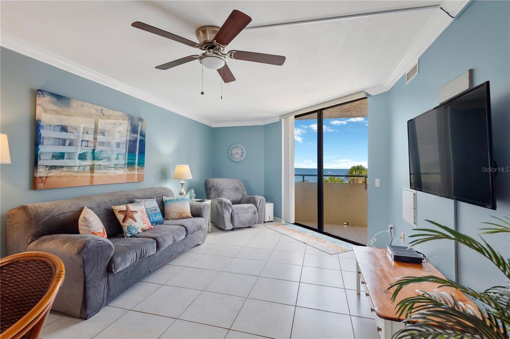 6009 Sea Ranch Drive, Unit 303 Hudson, FL 34667 - Photo 20 of 48 a living room with furniture and a flat screen tv