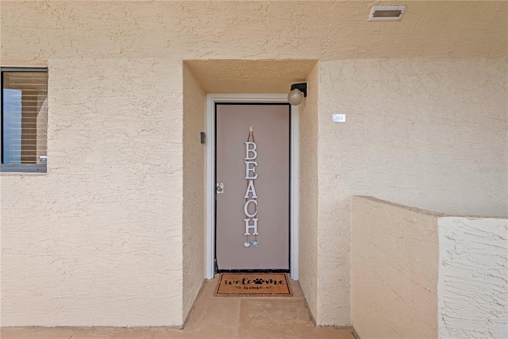 6009 Sea Ranch Drive, Unit 303 Hudson, FL 34667 - Photo 2 of 48 a view of an front door