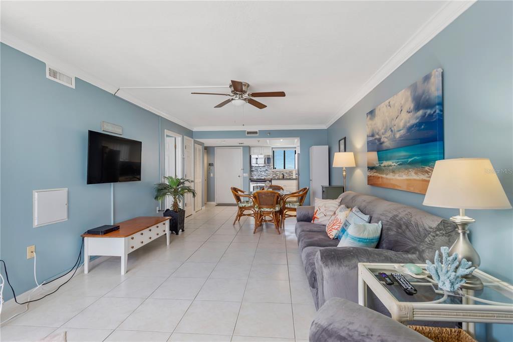 6009 Sea Ranch Drive, Unit 303 Hudson, FL 34667 - Photo 21 of 48 a living room with furniture and a flat screen tv
