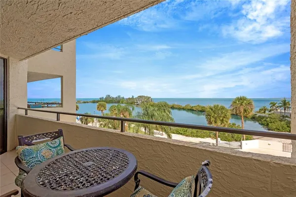 a view of a balcony with furniture