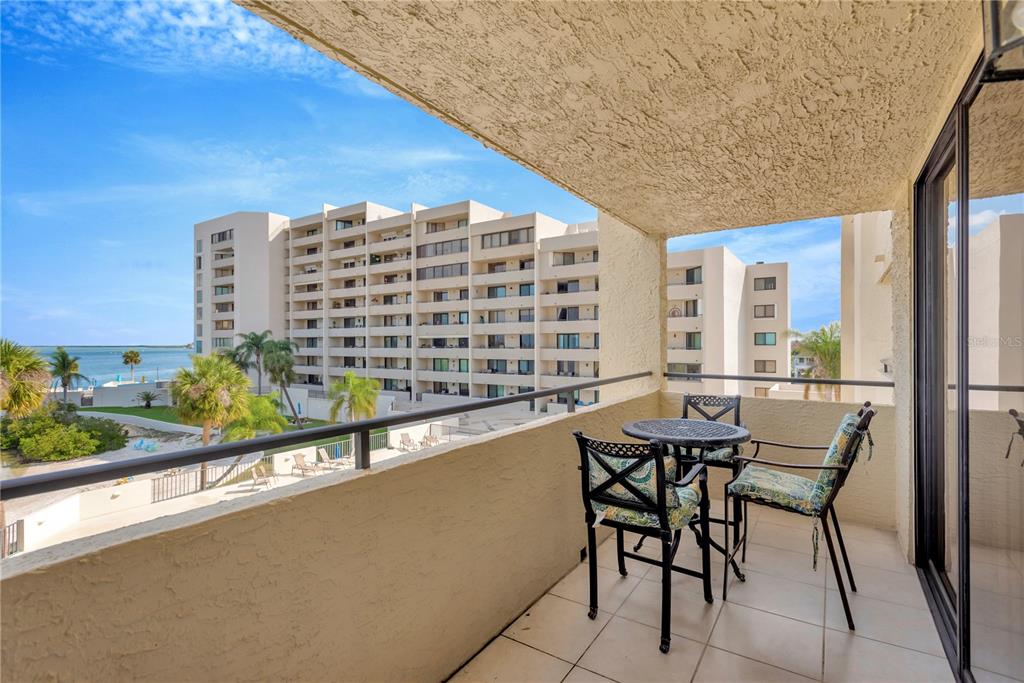 6009 Sea Ranch Drive, Unit 303 Hudson, FL 34667 - Photo 23 of 48 a dining room with a table and chairs