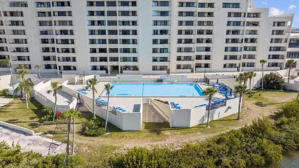 a view of a swimming pool with a patio