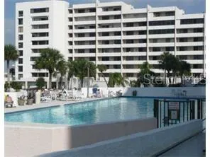 a view of a swimming pool with a lake view