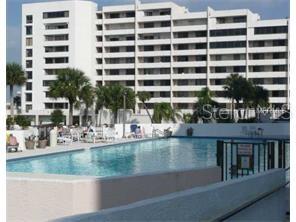 6009 Sea Ranch Drive, Unit 303 Hudson, FL 34667 - Photo 29 of 48 a view of a swimming pool with a lake view