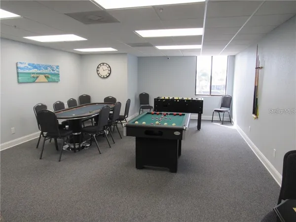 a room with furniture and air hockey table