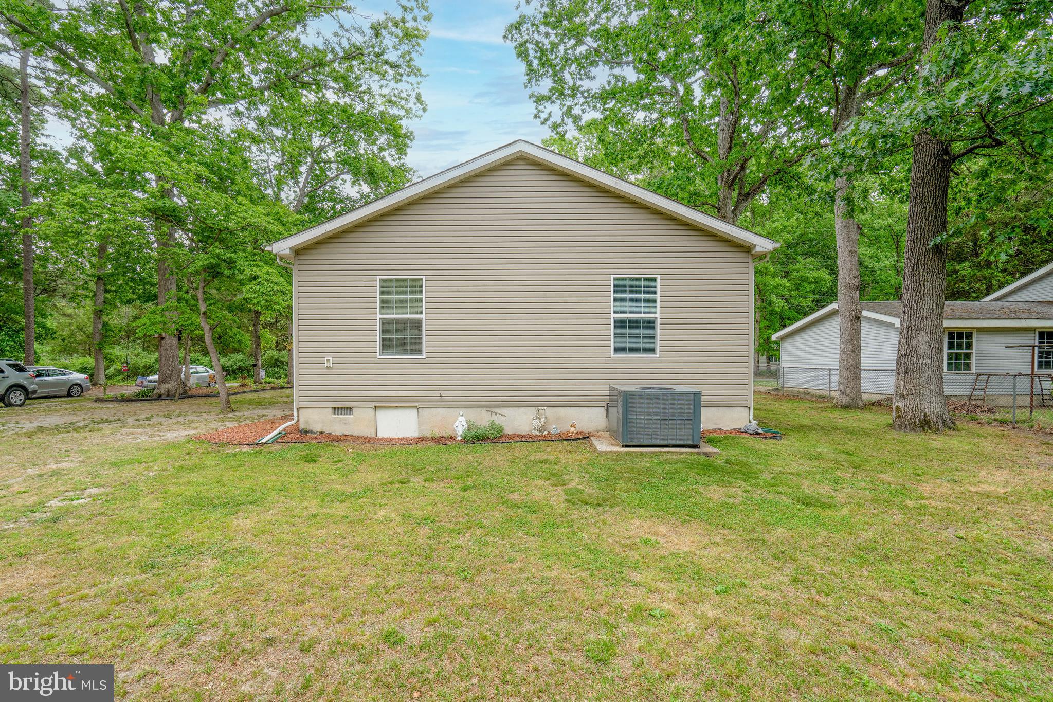 315 Beech Road Millville, NJ 08332 - Photo 20 of 21 a view of a house with a yard and plants
