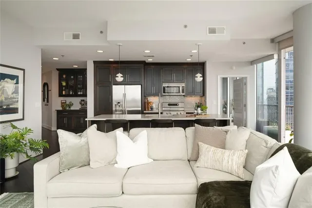 a kitchen that has a lot of cabinets in it and appliances