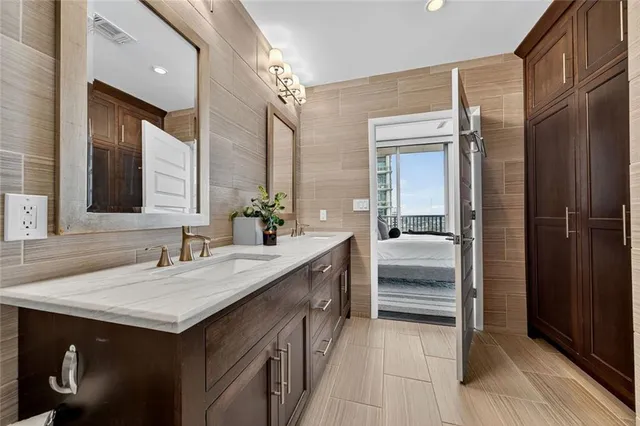 a open kitchen with stainless steel appliances granite countertop a stove and a sink