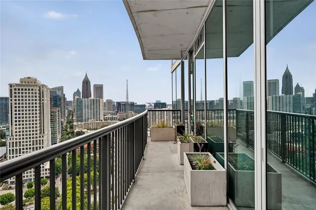 a bedroom with a bed and a potted plant