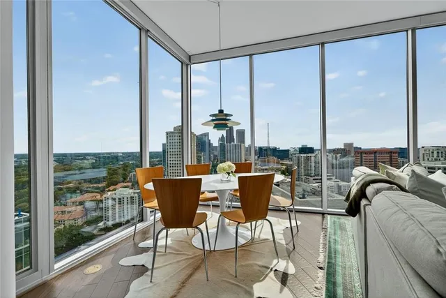 a view of a dining room with furniture window and outside view