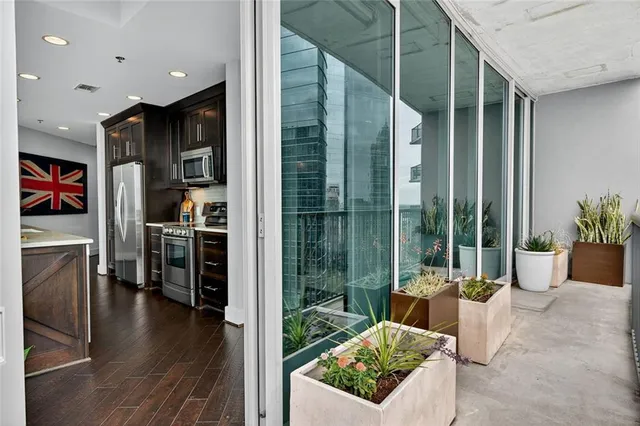 a bathroom with a toilet sink vanity and mirror