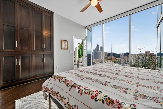 a view of a patio with plants and chairs