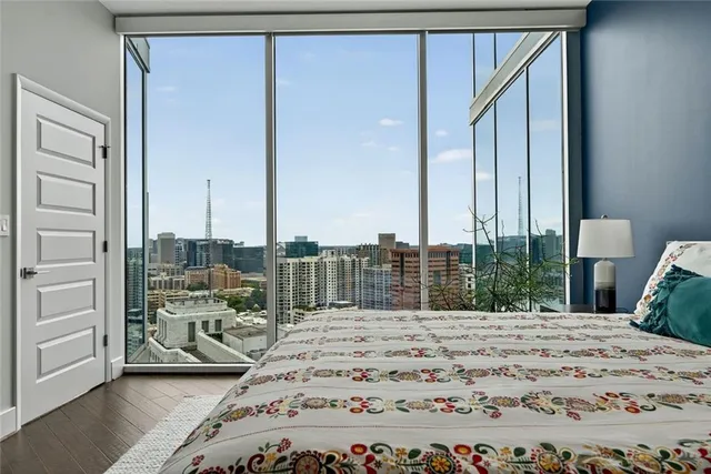 a view of a patio with a table and chairs and potted plants