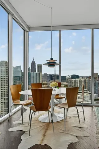 a view of a chairs and table in the balcony