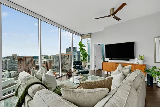 a living room with furniture and a flat screen tv