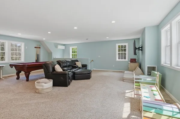 a living room with furniture a window and a table